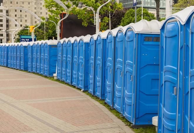 a row of portable restrooms set up for a large athletic event, allowing participants and spectators to easily take care of their needs in Sunland CA